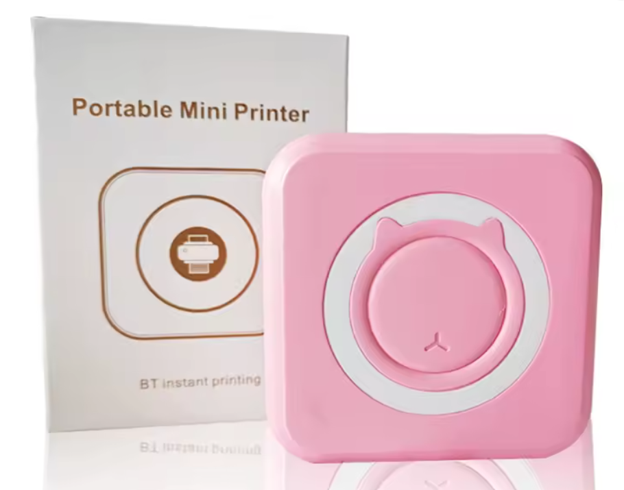 Portable mini Bluetooth photo printer in pink, printing a photo wirelessly from a smartphone