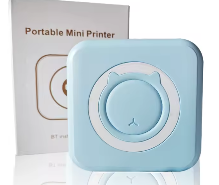 Portable mini Bluetooth photo printer in baby blue, printing a photo wirelessly from a smartphone